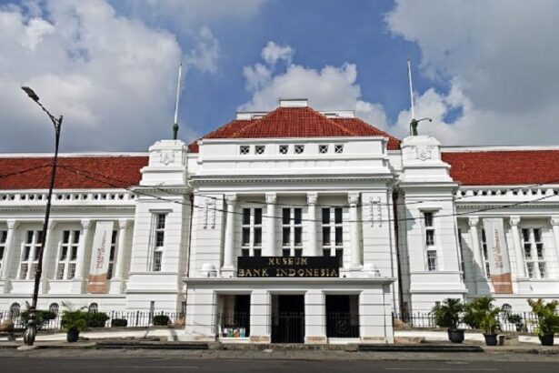 Front facade of the Bank Indonesia Museum: a white, neoclassical building with red-tiled roof and columns on a city street.