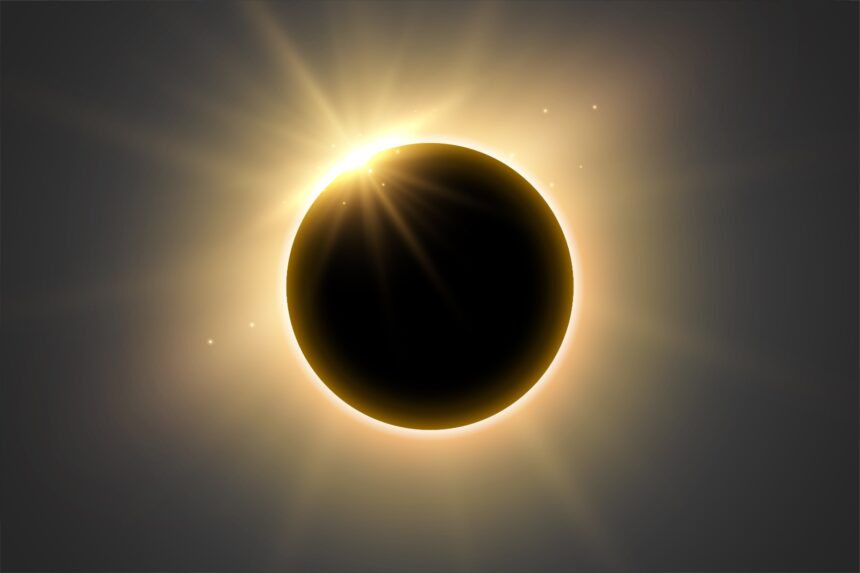 Solar eclipse showing a dark Sun obscured by the Moon with a bright solar corona haloing it.