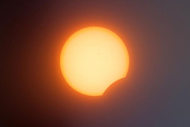 Partial solar eclipse: the Sun with a crescent bite where the Moon covers part of it.