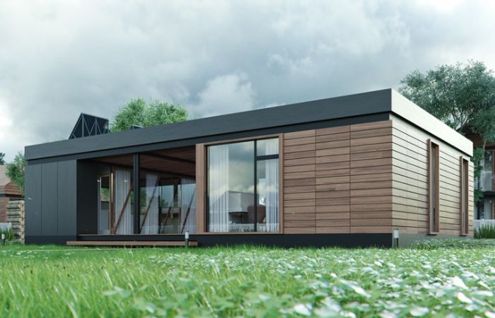xrdDAFze96GiiI9j333674837855948144t23110715 - Mabur.co Modern single-story house with wooden cladding and large glass doors, set on a green lawn with a cloudy sky above.