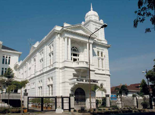 BI-Cirebon - Mabur.co White colonial-style Bank of India building with arched entrance and a black gate