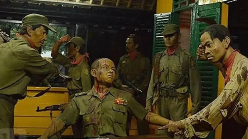 Diorama of soldiers in green uniforms; a man seated with arms extended while others surround him.