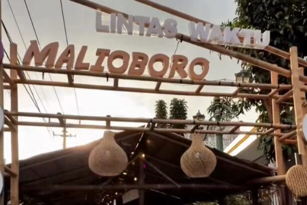 Entrance to a market stall with bamboo frame and hanging woven lanterns.