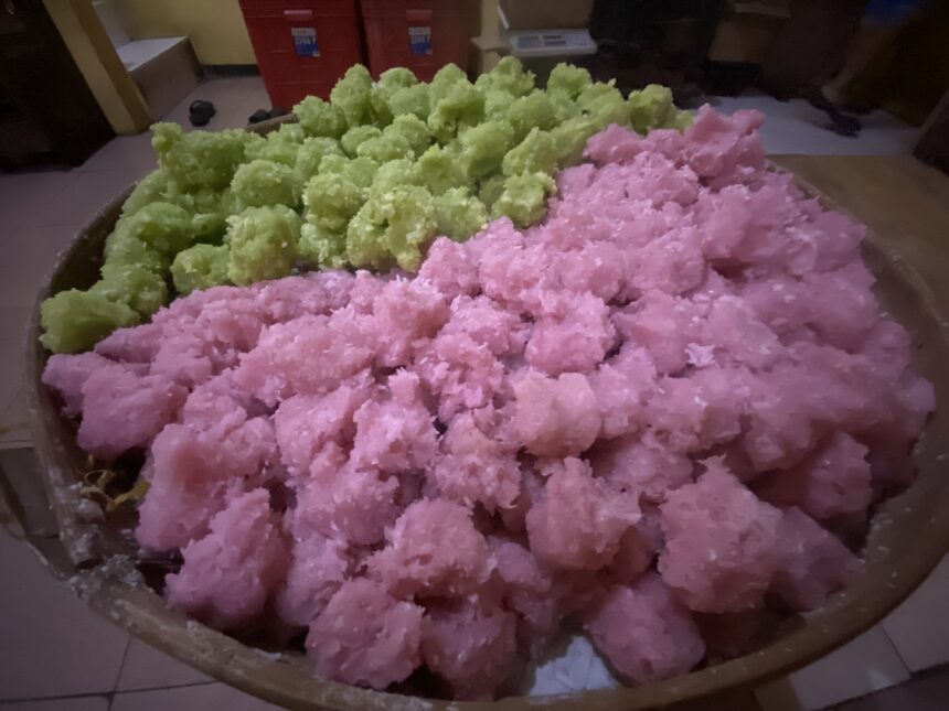 IMG_8596 - Mabur.co Pink and green fluffy snow-like dessert or candy heaped in a large bowl in a kitchen setting.