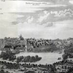 Engraved panorama of a walled fortress town along a river, with towers, church, and surrounding landscape.