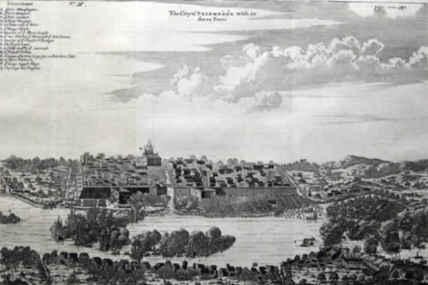 Engraved panorama of a walled fortress town along a river, with towers, church, and surrounding landscape.