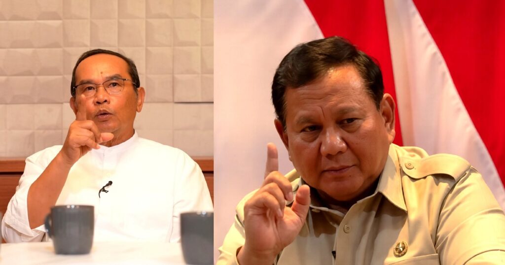 Two men at a panel, each with a raised index finger; left in a white shirt, right in a beige uniform, with a red‑white backdrop behind them.