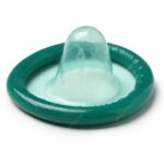Teal latex condom with a reservoir tip on a white background, ready for use (sexual health condom image)