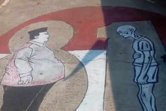 Mural on pavement showing a rotund man with a pink cape facing a tall, skeletal figure across a curved white path.