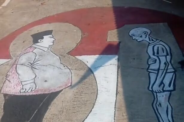 Mural on pavement showing a rotund man with a pink cape facing a tall, skeletal figure across a curved white path.