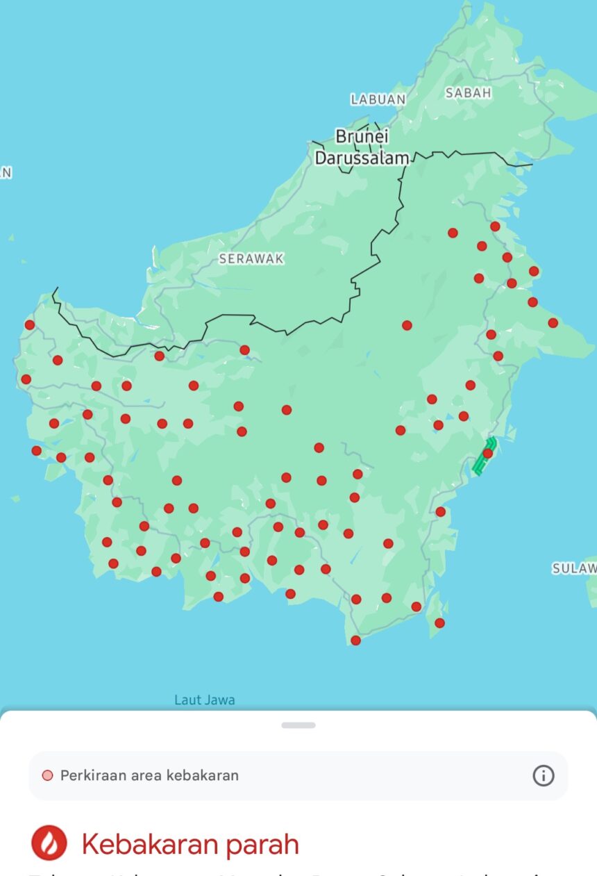 Map of Indonesia with numerous red markers indicating wildfire hotspots across the archipelago; legend mentions estimated fire area and severe fires.