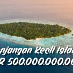Aerial view of a small tropical island with dense trees, surrounded by turquoise water; text overlay reads 'Menjangan Kecil Island IDR 500.000.000.000'