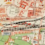 1935 map section showing roads, rail lines crossing a town with 'Lokasi (1935)' label at center-right.