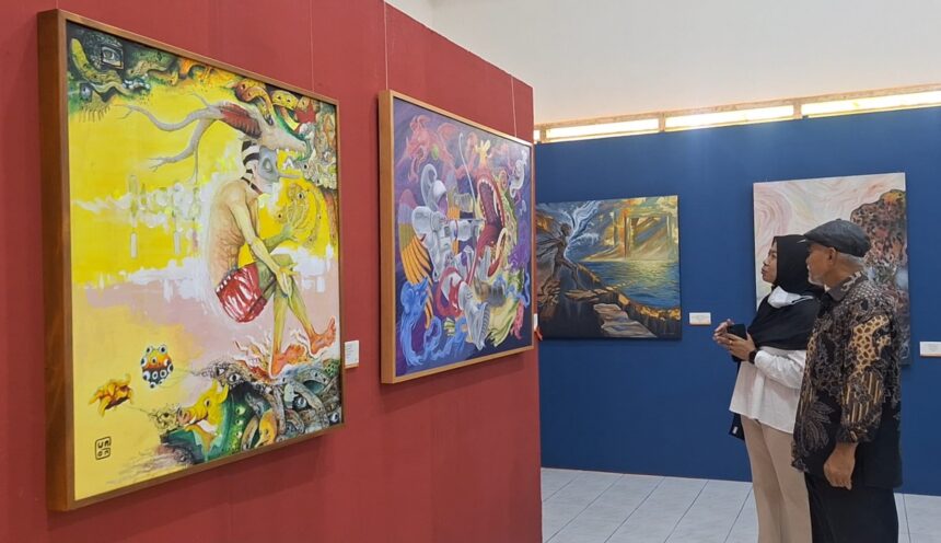 Two visitors stand side by side in an art gallery, admiring large colorful paintings on red and blue walls.