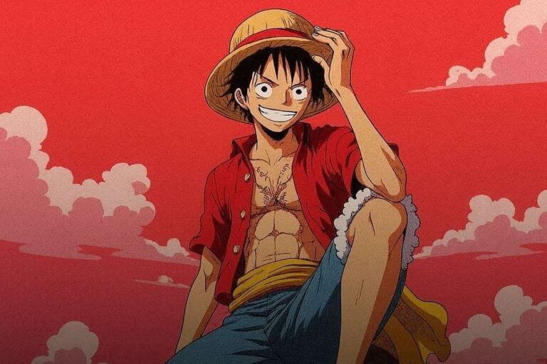 Luffy from One Piece smiling, wearing a straw hat, red open shirt and blue shorts, against a red sky with clouds.