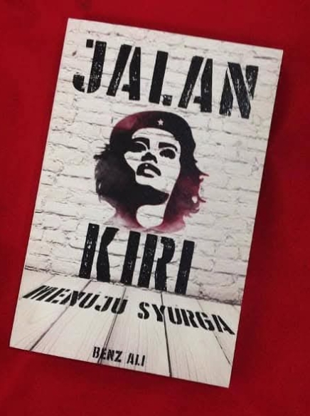 Stencil-style poster featuring a woman's portrait on a white brick background, tilted on a red surface; large text at top says 'JALAN KIRI' with additional text below.