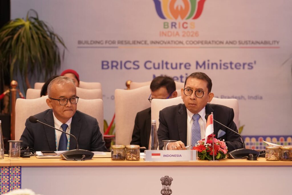 WhatsApp Image 2026-08-09 at 195142 - Mabur.co Two men in suits seated at a conference table with microphones, a BRICS banner in the background, and an Indonesia flag on the table