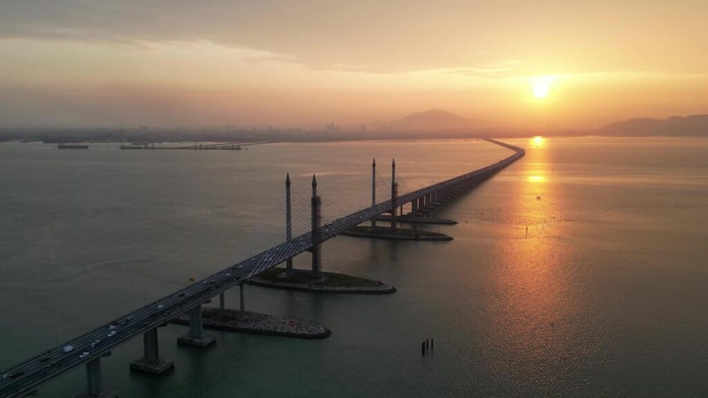aerial-view-golden-sun-over-silhouette-penang-bridge-video - Mabur.co