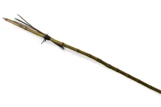 Long wooden spear with a sharpened tip, bound near the head, laid diagonally on a white background.