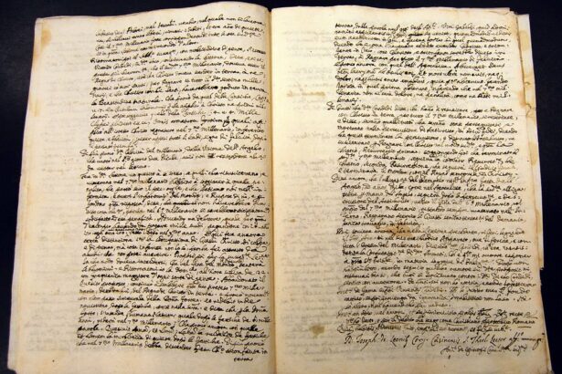 Open two-page spread of an antique manuscript with dense cursive handwriting and yellowed, stained pages on a dark background.