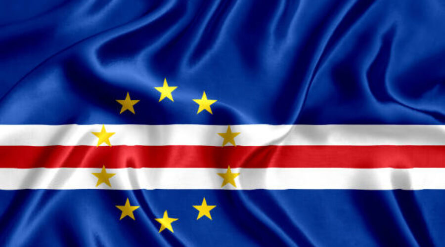 Flag with a blue field and a white-red horizontal stripe across the center, surrounded by a ring of yellow stars.