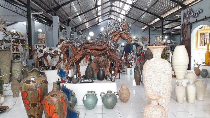Interior of a pottery shop filled with ceramic vases and a large ornate wooden horse sculpture at the center with silver detailing.