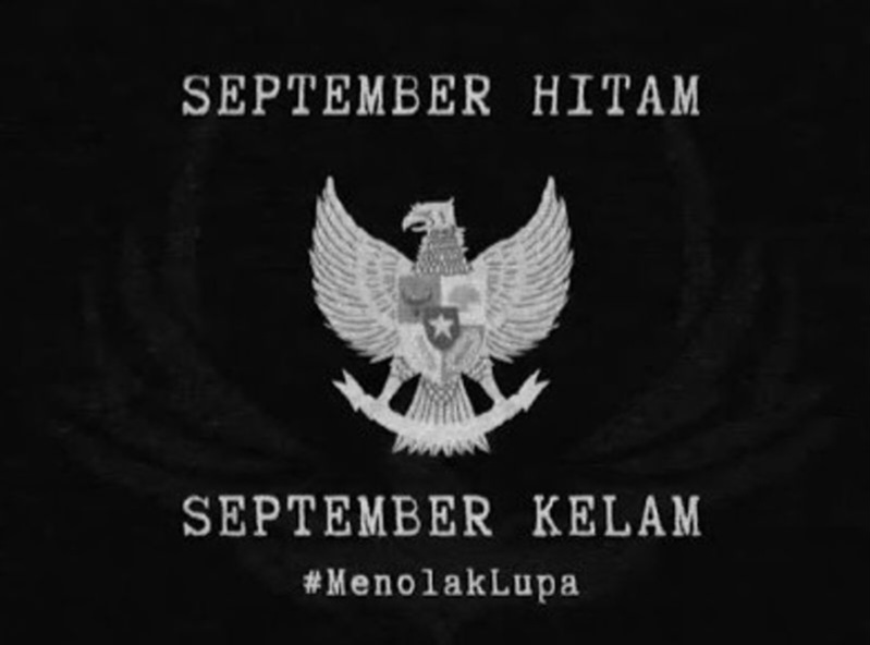 Black poster with the Garuda emblem and the phrases 'September Hitam' and 'September Kelam', plus the hashtag #MenolakLupa.