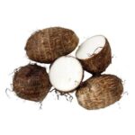 Five taro roots on a white background, one cut in half to reveal white starchy flesh in the center.
