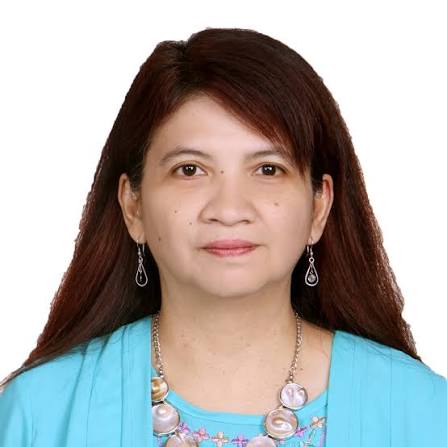 images 2 - Mabur.co Portrait of a woman with long dark hair, wearing a turquoise blouse and silver jewelry.