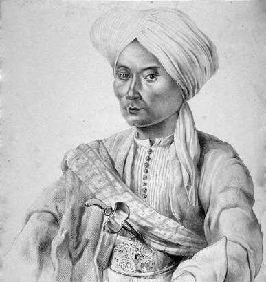 Portrait of a man in a turban and traditional robe, with a ceremonial sword across his chest.