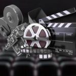 Collage of cinema equipment: film reels, a movie camera, and a clapperboard in a theater setting.