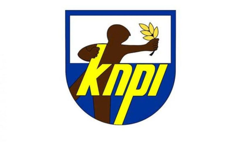 KDPI logo: blue shield with a brown figure offering an olive branch and bold yellow 'KDPI' lettering