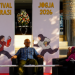 Panel discussion at Jogja 2026 Literasi Festival with three speakers seated on stage.