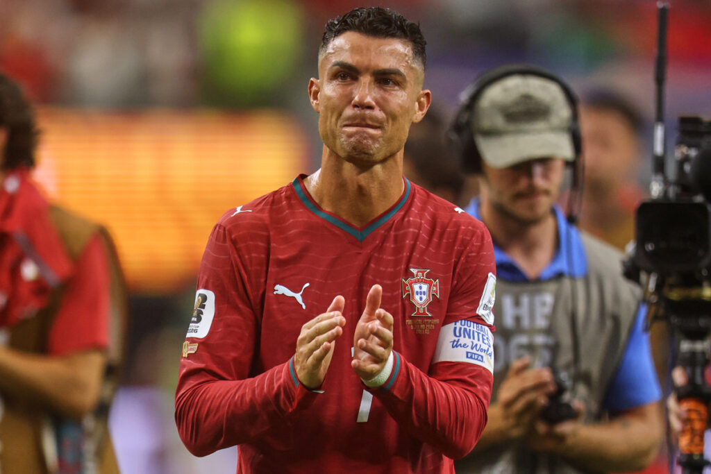 ronaldo in tears after wc 2026 exit by AP-Yonhap - Mabur.co Cristiano Ronaldo in Portugal red kit clapping on the field with a camera crew in the background