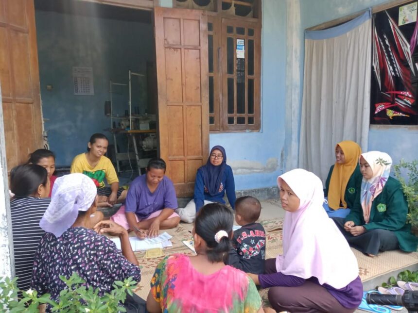 Group of women and children sit in a circle on a mat outside a blue house, likely a community gathering or lesson.