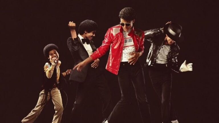 Four performers in Michael Jackson costumes pose and dance on a dark stage, iconic outfits and moves shared together.